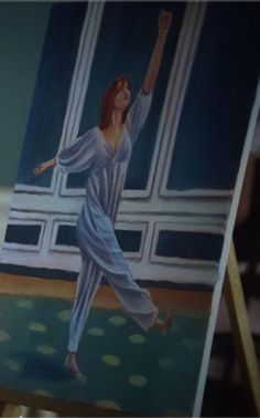 a painting of a woman dancing in front of an open window on a easel