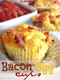 bacon egg muffins on a paper plate with other food in bowls behind them