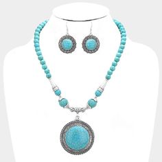 "Beautiful Burnished Silver Turquoise Beaded Round Pendant Necklace and Earring Set. Silver Metal Alloy. Lead & Nickel Compliant. Necklace Size: 20\" + 3\" L; Decor Size: 2.25\" L and Earring Size:1.75\" L. The Perfect Accessory to Add Just A Touch of Western Flair to Your Wardrobe." Turquoise Beaded Dangle Jewelry, Adjustable Turquoise Bohemian Jewelry Sets, Turquoise Dangling Beads Costume Jewelry, Turquoise Costume Jewelry With Dangling Beads, Turquoise Beaded Dangle Necklaces, Turquoise Dangle Jewelry With Colorful Beads, Turquoise Jewelry With Dangling Round Beads, Turquoise Beaded Costume Jewelry Necklace, Costume Jewelry Turquoise Beaded Necklace