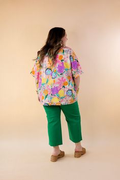 Elevate your style to a whole new level with our "Majestic Moment" poncho top. Bursting with charm, this top boasts a delightful fruit and floral print in vibrant spring colors, adding a touch of whimsy to any ensemble. The poncho silhouette offers an oversized fit, ensuring comfort without compromising on style. With drop sleeves and a chic V-neckline, it effortlessly combines fashion and flair. Step into the spotlight and make every moment majestic with this statement piece. Available in sizes Fruit Print Tops For Beach In Spring, Spring Tropical Print Relaxed Fit Blouse, Spring Blouse With Tropical Print And Relaxed Fit, Spring Tops With Kimono Sleeves And Relaxed Fit, Spring Tops With Relaxed Fit And Kimono Sleeves, Relaxed Fit Tops With Kimono Sleeves For Spring, Pink Fruit Print Tops For Spring, Spring Cotton Blouse With Kimono Sleeves, Casual Spring Blouse With Kimono Sleeves