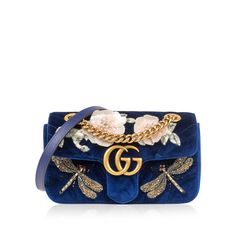 The It-Bag of all It-Bags, Gucci presents its highly-acclaimed GG Marmont flap bags - perhaps the most popular and in-demand handbag of the past 5 years. Designed by Alessandro Michele, this particular piece is crafted from luxurious royal blue velvet and features stunning sequin-embellished bees and flowers. Not your ordinary Marmont, the precise detailing makes this bag unique and s that you won't see on the shoulder of just anyone. Accented with antique gold-tone hardware and interior pink satin lining, this Marmont is the ideal compliment to pretty much any neutral-toned or monochromatic look. Though you'll want to take this bag out and show it off every day, this little gem requires a little extra TLC given its delicate features. Luxurious and glamorous, this piece is one you won't ge Bag Inspiration, It Bag, Bags Gucci, Delicate Features, Mini Handbag, Flower Bag, Alessandro Michele, Gg Marmont, Dior Shoes