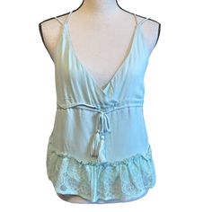 Honey Punch Light Mint Green Baby Doll Lace Hem Crop Tank Top Empire Style Tank Top With Criss Cross Adjustable Straps, V Neck With Tassel Tie Around Waist New With Tag - Measurements In Pictures Cute V-neck Top With Lace Trim, Ruffled V-neck Camisole For Beach, V-neck Ruffled Camisole For Beach, Cute V-neck Blouse For The Beach, Cute V-neck Blouse For Beach, Beach Camisole Tops With Lace Trim, Cotton Lace Top Camisole For The Beach, Beach Cami Tops With Lace Trim, Beach Cotton Camisole Blouse