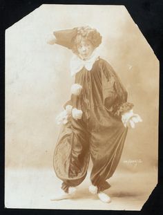 an old photo of a child dressed as a clown