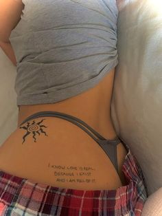 a woman with a tattoo on her stomach