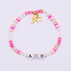 a bracelet with the word aoa written on it and a gold star charm attached to it