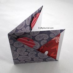 an origami bird is on top of a sheet of paper with the title 6 pockets from 1 sheet of paper