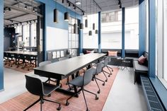 an empty conference room with chairs and tables