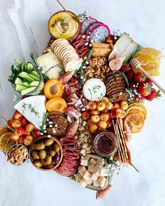 a bunch of food that is on top of a white tablecloth with the caption's name underneath it