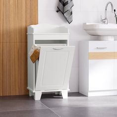 a bathroom with a sink, cabinet and mirror