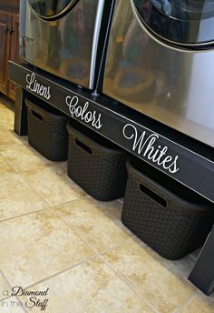 three laundry baskets sitting next to each other in front of a washer and dryer