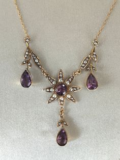 Superb attractive Victorian 9ct gold Amethyst and Pearl Necklace. Very beautiful antique necklace with four large amethyst stones surrounded by pearls and floral motifs, leaves and drops. Very pretty necklace in absolutely excellent condition Marked 9ct. Weight 6.3 grams. Length 22 Inches - 55 cms.   Please Check Sizes And Weights As JEWELLERY IMAGES ARE ENLARGED. Dark areas are reflections on the gold.  BUY WITH CONFIDENCE: I try to accurately describe my items. I never knowingly mis-sell any item, so please read the description carefully. All items are checked by a professional Jeweller for authenticity; however no certificates are provided. If for any reason the item is found not to be genuine or as described a full refund will be given. So please buy with confidence.  Your jewellery wi Antique Amethyst Jewelry, Jewellery Images, Antique Jewelry Victorian, Antique Wedding Rings, Amethyst Stones, Pretty Necklace, Victorian Gold, Pretty Necklaces, Antique Necklace