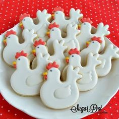 several decorated cookies on a white plate