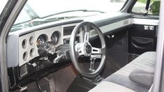 the interior of an older model truck is clean and ready for customers to ride in