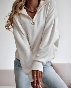 white White V-neck Top With Ribbed Cuffs, White Winter Leisure Sweater, White Sweatshirt For Fall Leisure, White Sweater For Leisure In Fall, White Leisure Sweatshirt, White Long Sleeve Tops For Leisure, White Stretch Sweatshirt For Fall, Trendy Long Sleeve Winter White Top, Trendy Long Sleeve Tops In Winter White