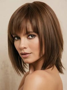 This mid-length shag with blunt bangs combines texture with a modern edge, ideal for those who want to rock a trendy, effortless style. The shaggy layers add movement and volume to the hair, while the blunt bangs bring a structured contrast. Soft Blonde Highlights, Long Bob Styles, Winter Haircuts, Shaggy Layers, Long Bob With Bangs, Textured Bangs, Soft Blonde, Straight Bangs, Tousled Waves