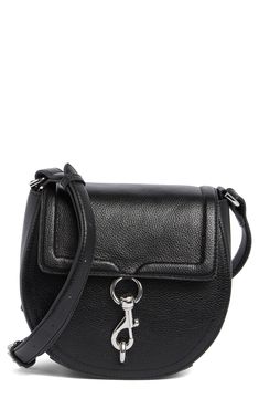 Smooth leather defines this chic and compact saddle bag fashioned with a front snap-flap closure and gleaming silvertone hardware. Snap-flap closure Top crossbody strap Interior slip pocket Lined Leather Imported Modern Crossbody Saddle Bag With Turn-lock Closure, Classic Satchel With Silver-tone Hardware And Flap, Black Crossbody Saddle Bag With Metal Hardware, Classic Crossbody Saddle Bag With Silver-tone Hardware, Classic Saddle Crossbody Bag With Silver-tone Hardware, Flap Bag With Silver-tone Hardware, Classic Leather Saddle Bag With Silver-tone Hardware, Black Leather Saddle Bag With Silver-tone Hardware, Black Crossbody Flap Bag With Turn-lock Closure