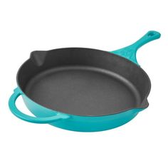 a blue cast iron skillet on a white background