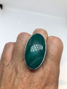 Large green agate Ornate German Silver Vintage ring, does not tarnish Size 9 can be re sized, my jeweler charges a $10 - $15 fee All rings are shipped in a nice gift box. Check out our over a THOUSAND great reviews Engraving is $4 per letter and is not always perfect depending on the piece. It can take a few days if the jeweler is busy. This is payable to Paypal Judithsltd@gmail.com Green Agate Oval Rings, Green Oval Agate Rings, Nickel-free Green Agate Jewelry, Nickel Free Oval Green Ring, Adjustable Green Rings With Large Stone, Adjustable Green Ring With Large Stone, Green Oval Crystal Ring With Natural Stones, Nickel-free Green Oval Ring, Bloodstone Jewelry