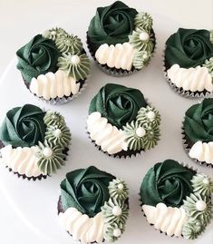 six cupcakes with green frosting and white icing on a platter