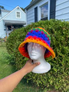 This simple and cute rainbow crochet bucket hat is made with 100% acrylic yarn. This hat is a unisex hat and is cute and simple granny stitch design.  Perfect for a cute head accessory for outfits, outings or any activities. HANDWASH AND AIRDRY THIS MATRIAL HAS A SLIGHT STRETCH Measurement of head circumference  medium adult (21-23inches) large adult (24-25inches)