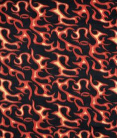 an orange and black animal print fabric with red flames on it's back ground