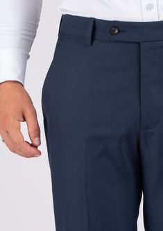 The Navy Sharkskin pants are the perfect choice for any smart occasion. Crafted with a luxurious navy sharkskin fabric and custom made for a premium appearance, they have a deep blue color, a stylish and modern cut, and will make you look and feel confident. Elegant Blue Pants With Straight Hem, Navy Fitted Dress Pants For Business Casual, Fitted Navy Dress Pants For Business Casual, Elegant Navy Tapered Leg Dress Pants, Navy Elegant Tapered Leg Dress Pants, Elegant Navy Bottoms For Semi-formal Occasions, Elegant Tailored Navy Dress Pants, Fitted Navy Straight Dress Pants, Navy Fitted Bottoms For Semi-formal Occasions