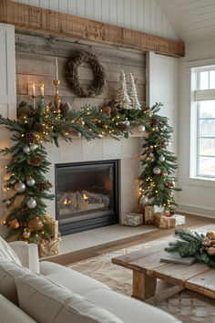 a living room filled with furniture and a fire place covered in christmas garlands next to a fireplace