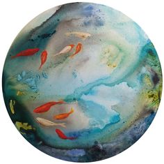 a plate with fish swimming in the water