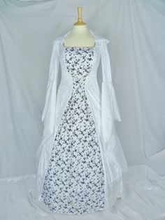 This dress will be made to the measurements you send me.Please send me your bust,waist and hip measurements and please measure from the top of your shoulder to the floor with shoes on.It will be made with beautiful white velvet and stunning white and black flock taffeta fabric. The sleeves are part white velvet and taffeta. It has a corset style front and back will lacing so you can adjust the dress to fit your body shape.Combined shipping on multiple items.If you purchase express shipping by co Wedding Corset Dress With Sweep Train And Fitted Bodice, Lace Corset Dress For Wedding, Wedding Corset Dress With Sweep Train, Fitted Ball Gown With Sweep Train For Wedding Night, White Fitted Ball Gown Dress, Fitted Bridesmaid Gown With Long Train, White Fitted Dress With Long Train, Wedding Dress With Fitted Bodice And Customizable Length, White Gown With Sweetheart Neckline