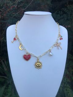 an arrangement of different charms that feel fun,cute and personal made with tarnish resistant gold chains Charm Necklace Diy, Necklace Diy, Diy Crystals, Gold Charm Necklace, Fun Cute, Charm Necklaces, Gold Charm, Diy Necklace, Crystal Bracelets