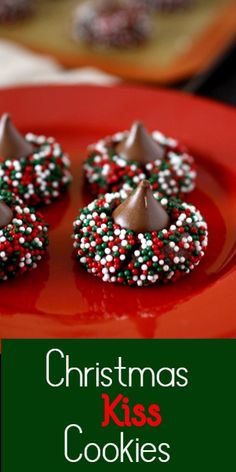 christmas kiss cookies on a red plate with white and green sprinkles in the middle