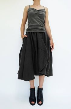 "🚚..ALL ORDERS ARE SHIPPED VIA DHL EXPRESS MAIL Treating every design as a piece of art, look no further than asymmetric midi skirt/pants. This special design skirt has one leg of pants. Asymmetric panelled construction. Wide elastic waistband. Tonal stitching. Asymmetric hem. * Pull-on style * 2\" elastic waistband * The skirt has one left leg of pants * Tonal stitching * Side seam pockets * Asymmetric hem * Unlined Measurements approximately: Waist: 26\" stretching to 46\" (66 cm-117 cm)-elas Asymmetrical Skirt With Pockets For Fall, Baggy Skirt For Fall, Asymmetrical Cotton Skirt For Fall, Cotton Asymmetrical Skirt For Fall, Fall Bottoms With Asymmetrical Hem And Pockets, Fall Bottoms With Pockets And Asymmetrical Hem, Asymmetrical Cotton Skirt With Relaxed Fit, Asymmetrical Cotton Bottoms For Fall, Asymmetrical Gathered Skirt Bottoms For Spring