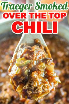 a spoon full of chili with the title text overlay reads trader smoked over the top chili