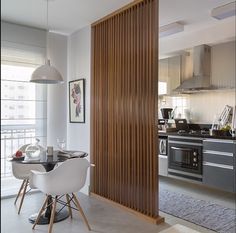 an open kitchen and dining room with sliding doors