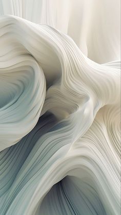 an abstract image of white and blue waves in the water, as seen from above