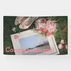 there is a picture frame with flowers on it and the words congratulations written in pink