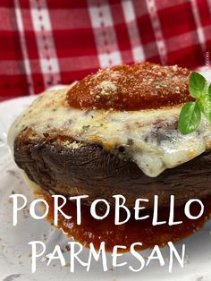 a close up of a piece of food on a plate with the words portabello parmesan