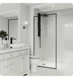 a white bathroom with two sinks and a shower