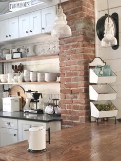 an instagram photo of a brick wall in a kitchen