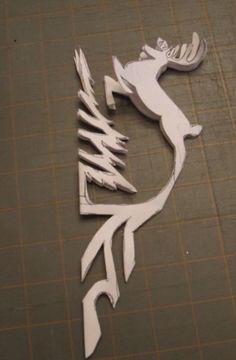 a piece of paper cut out to look like a deer