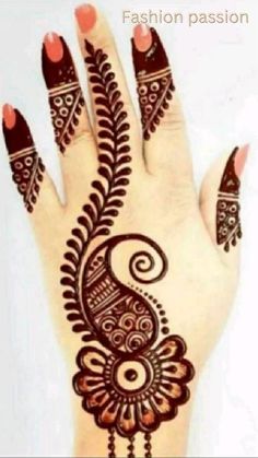 a hand with henna tattoos on it