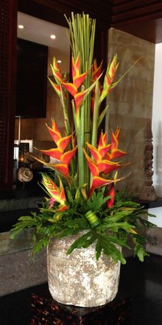 a vase filled with flowers on top of a table