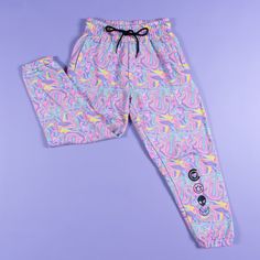 Keep warm and comfy with our Weird N Wavy Joggers. The joggers feature a custom-printed pattern and four printed icons on the lower left leg 80% cotton / 20% polyester fleece 100% polyester lining Casual Multicolor All-over Print Pants, Casual Multicolor All Over Print Pants, Casual Multicolor Pants With All Over Print, Sporty Pink Bottoms With Graphic Print, Sporty Pink Graphic Print Bottoms, Pink Sporty Bottoms With Graphic Print, Sporty Multicolor Loungewear Bottoms, Casual Sweatpants With Graphic Print, Casual Multicolor Joggers With Elastic Waistband