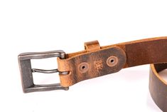 Leave a customer note on the checkout page requesting your free muslin pouch and belt box for easy gift giving! Here's the same belt as our gorgeous 1 1/2" wide solid, full grain Water Buffalo in distressed brown - only now it's in the slimmer 1 1/4" width. Our customers can't seem to get enough of our distressed brown solid full grain buffalo and now we've coupled it with a buckle in the hottest color in accessories of the year - copper! Then we cut the tip on an angle to make this men's or wom Rugged Distressed Brown Belt With Antique Buckle, Distressed Brown Rugged Belt Buckle With Antique Finish, Rugged Distressed Brown Belt Buckle With Antique Finish, Rugged Distressed Brown Belt Buckle With Antique Buckle, Rugged Distressed Brown Belt Buckles For Everyday Use, Rugged Distressed Brown Belt Buckle For Everyday Use, Rustic Distressed Brown Belts For Everyday, Vintage Distressed Brown Belt For Everyday Use, Water Buffalo