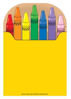 crayons are lined up in a cardboard box with the bottom half painted yellow