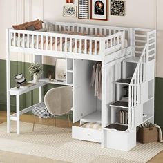 a white loft bed with stairs and desk underneath