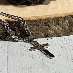 "Silver stainless steel cross and chain made of durable 316L grade stainless steel which is tarnish resistant and does not fade. Perfect for every day wear. The cross is 1 1/2\" in length including the bail and 1/2\" wide. The chain is a 4mm wide Figaro chain in your choice of length. This necklace comes with a black velvet jewelry pouch inside a marble kraft gift box with silver cord. Included with the cross is a wallet size scripture verse card that reads: I can do all things through Christ wh Silver Cross Necklace With Figaro Chain, Silver Cross Necklace With Figaro Chain As Gift, Men Cross Necklace, Cross Necklace Mens, Cross Necklace For Men, Necklace For Him, Bible Verse Necklace, Personalized Cross Necklace, Mens Cross Necklace