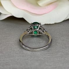 This ring is an oval lab created emerald with diamond sides, 14k white gold #5543 We feature the finest quality lab grown emeralds in the world. The properties of lab-grown are physically, chemically and visually identical to natural, just grown in a lab setting. Emerald is the birthstone of May -Approximate total carat weight: 2.25ctw diamond equivalent -Center Stone Size: approx. 2.10ct diamond equivalent -Center Stone Shape: oval 9x7mm -Gem Type: lab created emerald -Stone Clarity: VS2 -Stone Emerald Engagement Ring Oval, Promise Ring Emerald, Oval Emerald Engagement Ring, Emerald Promise Ring, Emerald Engagement Ring Green, Engagement Ring Oval, Emerald And Diamond Ring, Green Ring, Green Rings