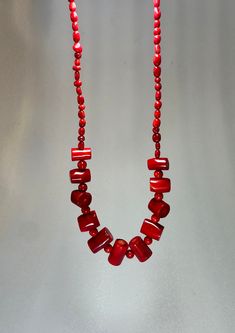 **Vintage Chunky Red Coral Necklace** Add a touch of timeless elegance to your collection with this Vintage Chunky Red Coral Necklace. This exquisite piece of vintage coral jewelry boasts bold, vibrant red beads that make a stunning statement. Perfect as a red statement necklace, it complements any outfit, whether casual or formal. Ideal for beach lovers, this necklace also serves as a thoughtful beach lover gift or a unique accessory for a beach wedding. Celebrate the natural beauty of coral and elevate your style with this one-of-a-kind treasure. Red Coral Beaded Jewelry, Red Coral Beaded Necklaces With Large Beads, Red Coral Jewelry With Colorful Beads, Red Beaded Coral Jewelry, Vintage Red Beaded Jewelry, Handmade Red Beads For Costume Jewelry, Red Coral Beads, Vintage Red Gemstone Beads Jewelry, Red Vintage Jewelry With Gemstone Beads