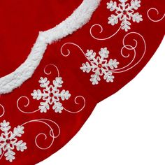 a red christmas stocking with white snowflakes on it